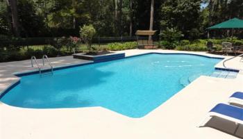 Remodeled old pool from cracked concrete to beautiful new marcite with blue accent tile border.